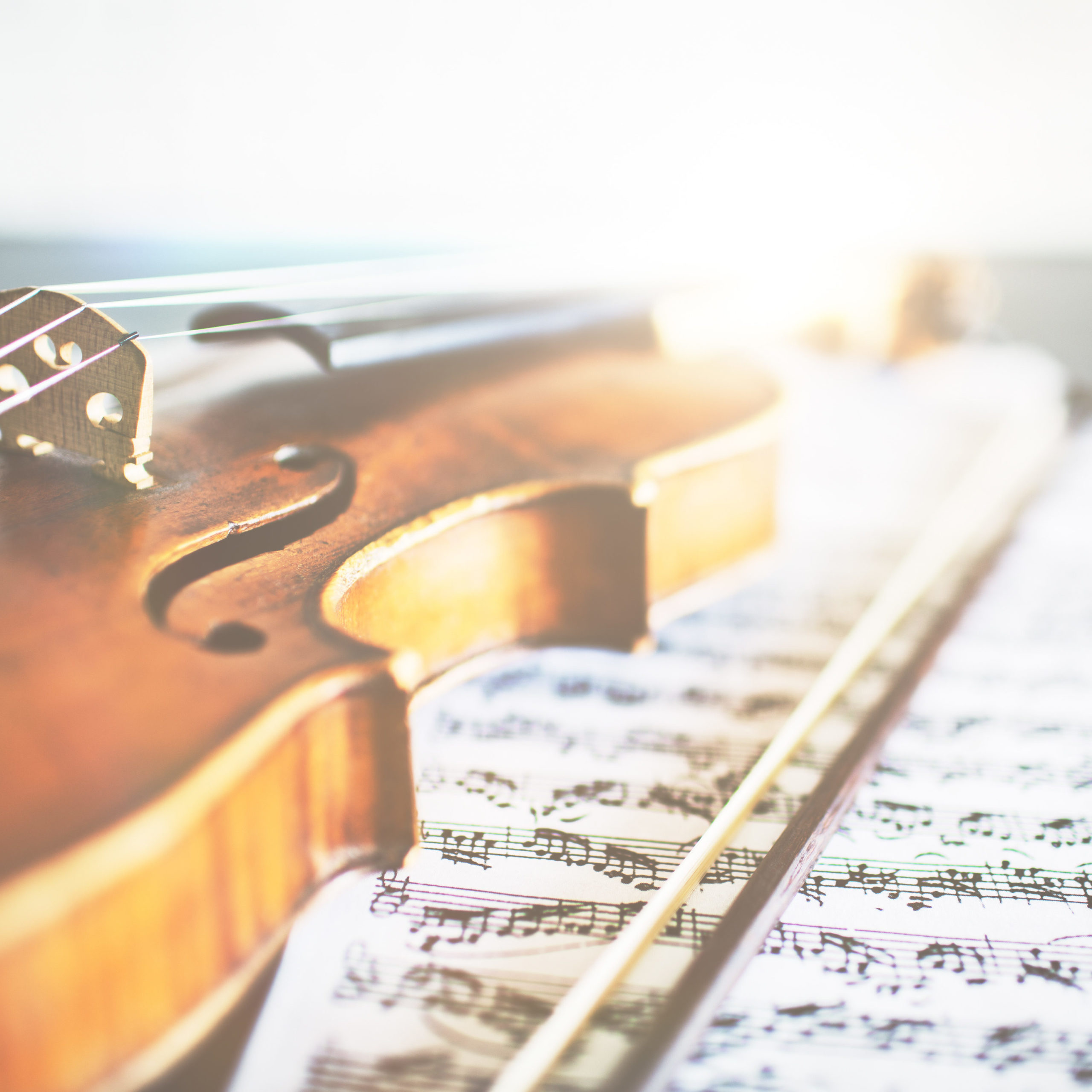 violin and sheet music in preparation for Suzuki group class